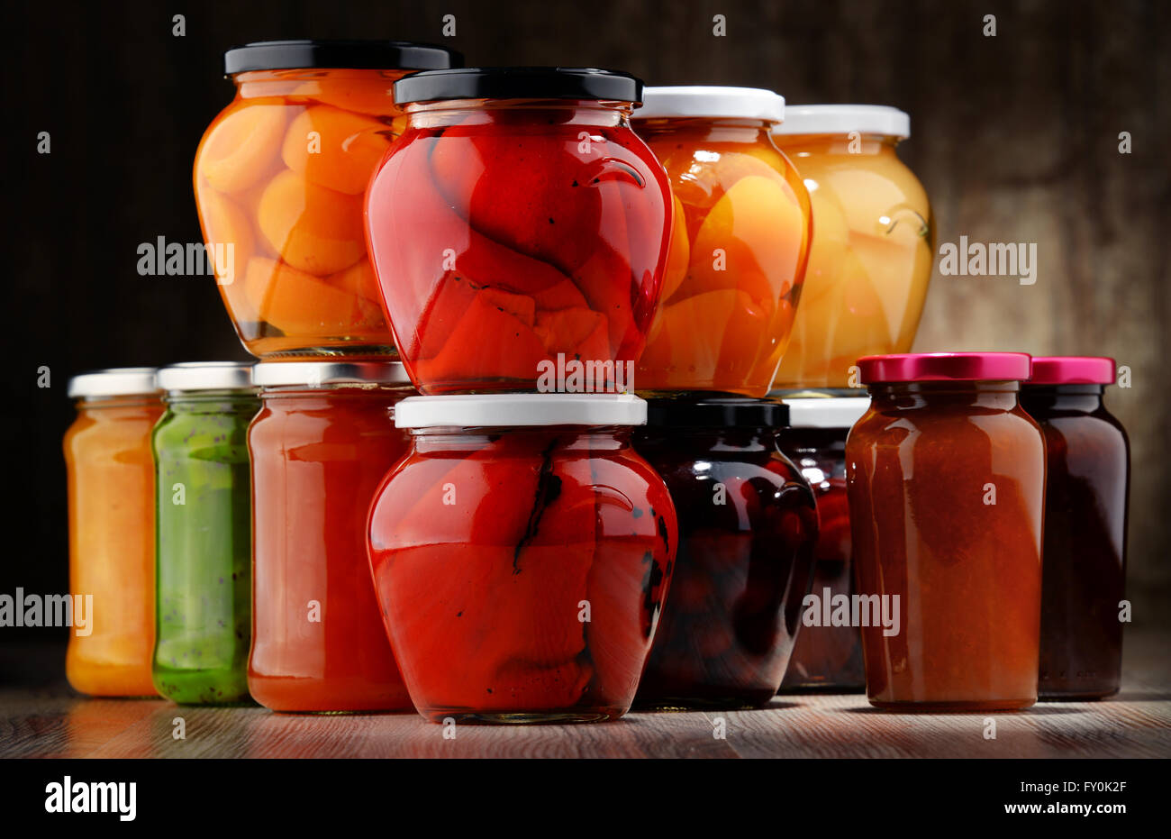 Jars with fruity compotes and jams. Preserved fruits Stock Photo Alamy