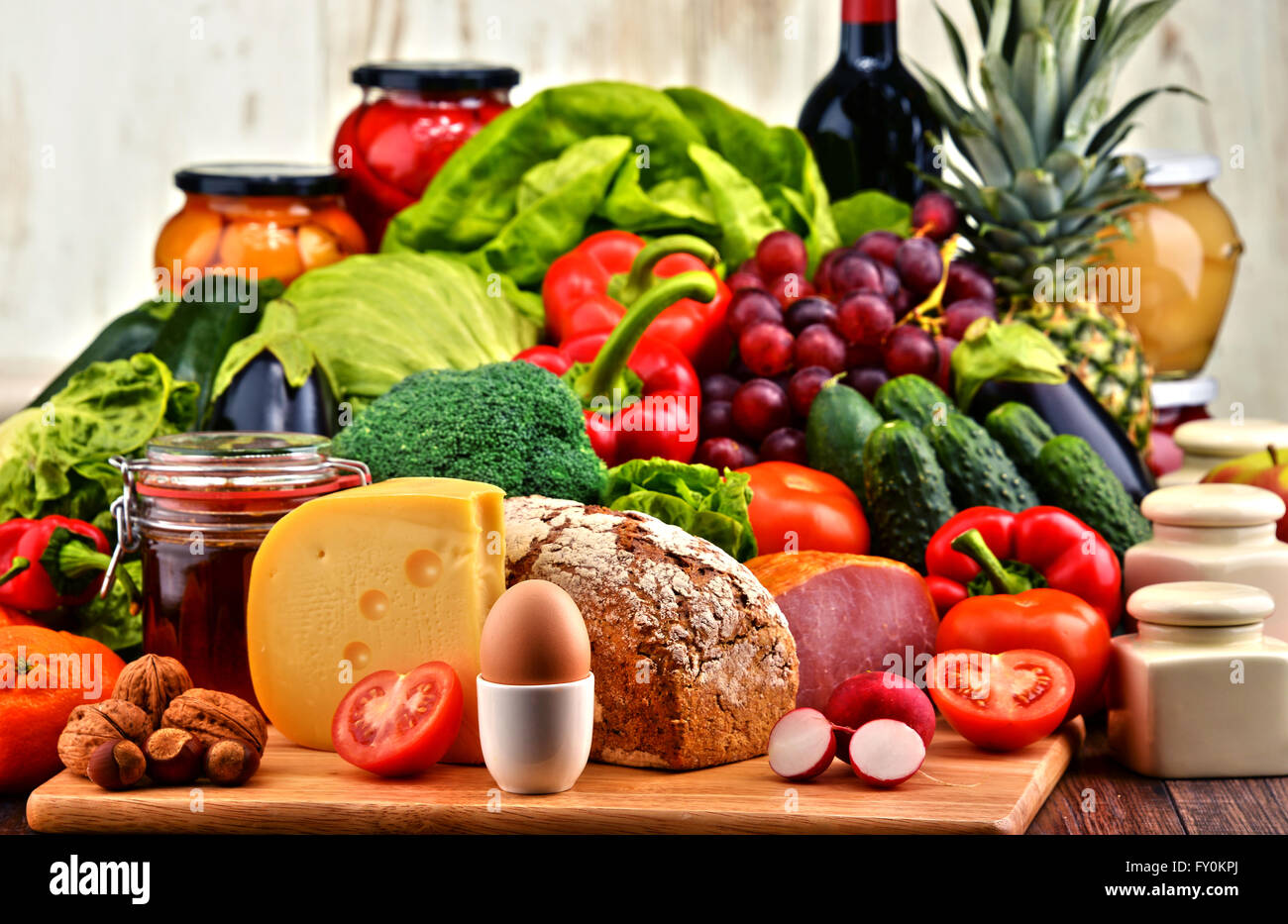 Variety of organic food including vegetables fruit bread dairy and meat. Balanced diet. Stock Photo