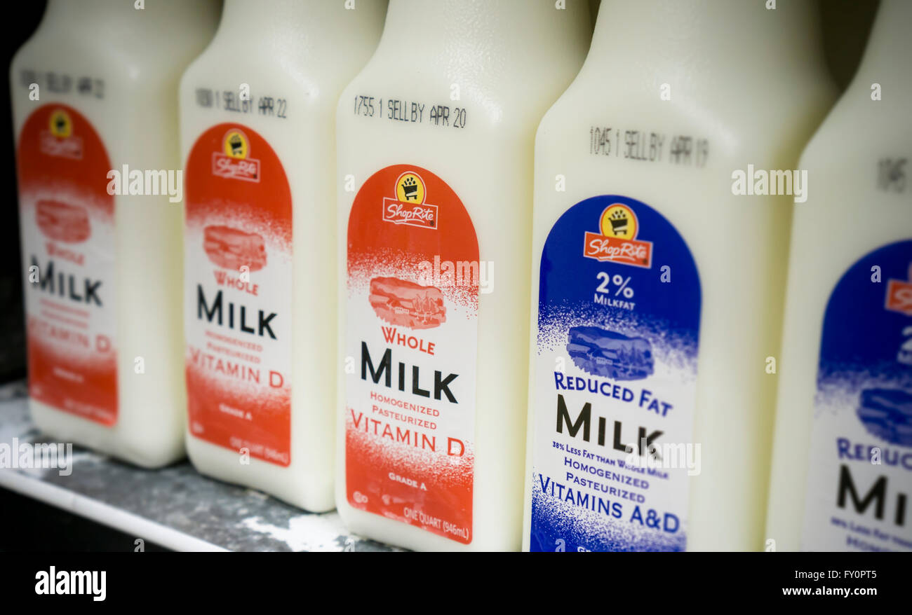 Containers of whole and reduced fat milk in a supermarket in New York on Thursday, April 14, 2016. A recent report from the European Journal of Nutrition concluded that whole milk may be better for you than reduced fat products. Researchers found no difference between those who used either product in terms of diabetes and cardiovascular disease.  (© Richard B. Levine) Stock Photo