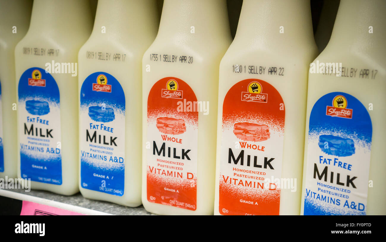 Containers of whole and reduced fat milk in a supermarket in New York on Thursday, April 14, 2016. A recent report from the European Journal of Nutrition concluded that whole milk may be better for you than reduced fat products. Researchers found no difference between those who used either product in terms of diabetes and cardiovascular disease.  (© Richard B. Levine) Stock Photo