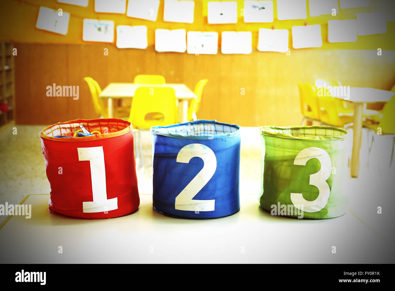 Three containers for toys with numbers one two three Stock Photo