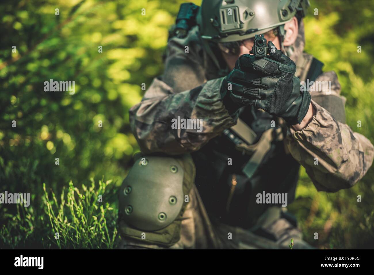 Solider with Handgun. Special Forces Military Mission Concept Photo. Stock Photo