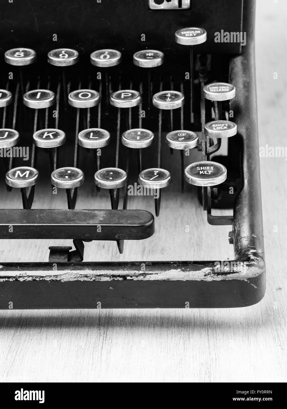 Close up of a vintage typewriter machine in black and white. Stock Photo