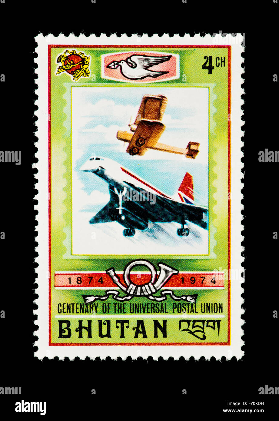 Postage stamp from Bhutan depicting an old biplane and a modern jetliner. Stock Photo