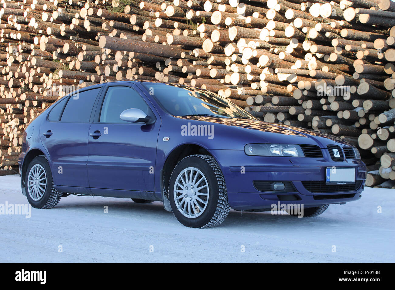 Blue Seat Leon 2005 in front of a pile of stock Stock Photo