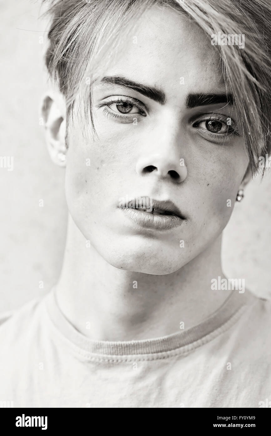 Young male, man with big eyes and feminine looks in black and white Stock  Photo - Alamy