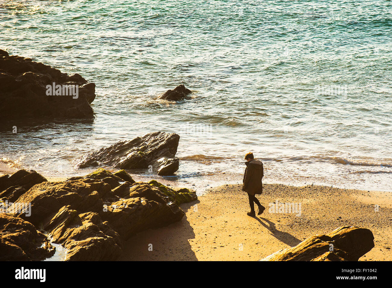Person walks on beach hi-res stock photography and images - Alamy
