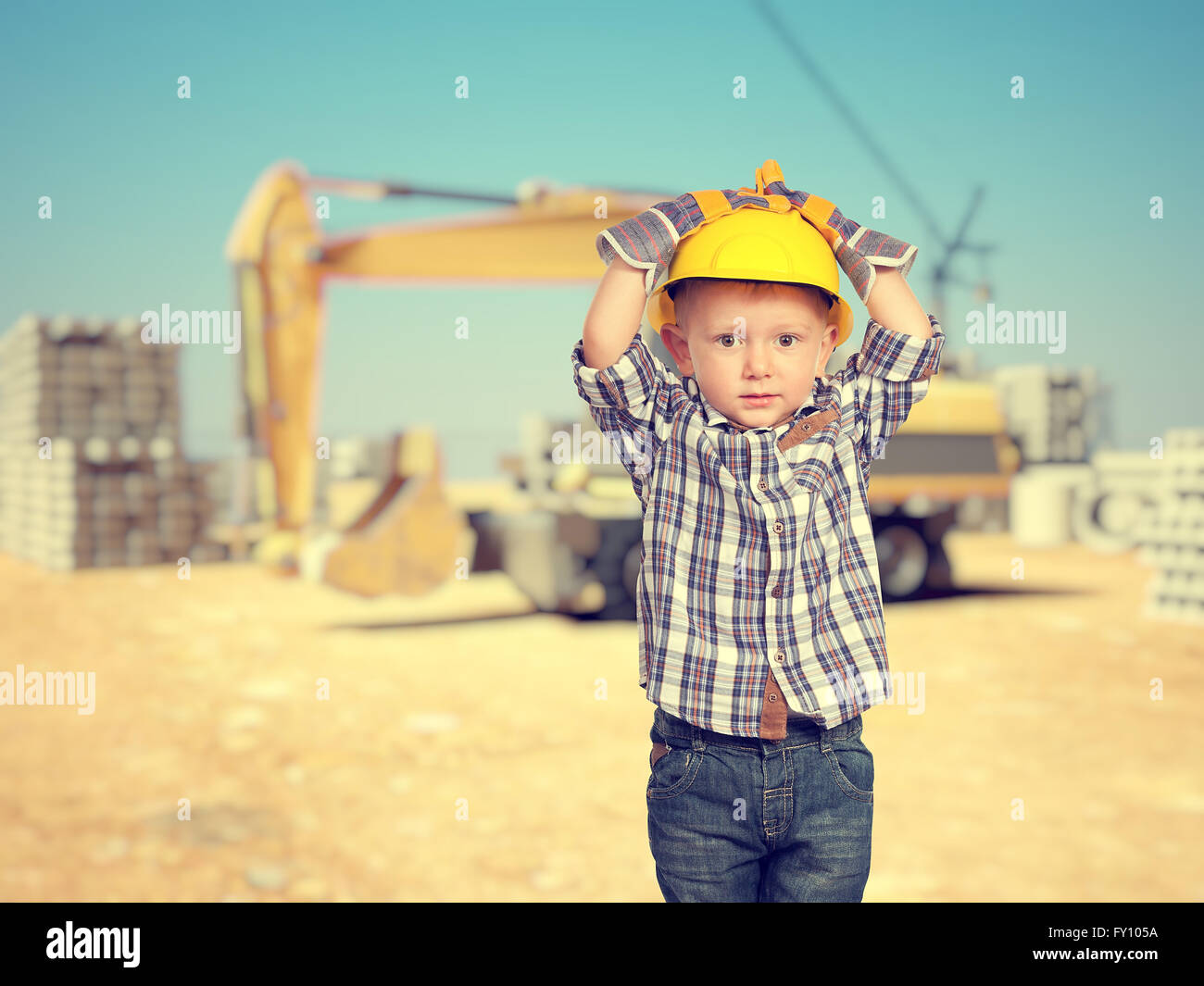 little handyman at construction site Stock Photo