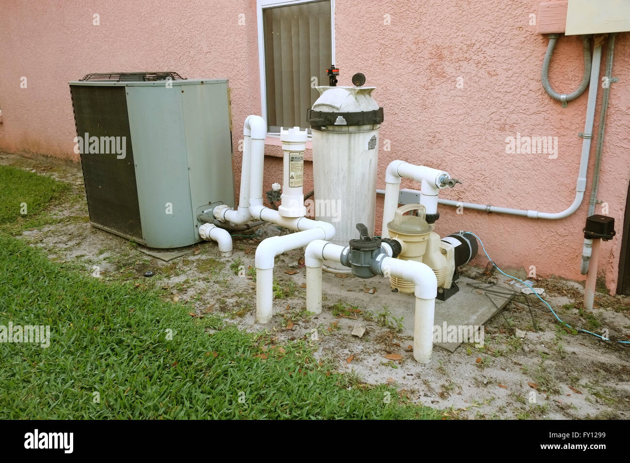 American domestic swimming pool filter and heater beside a Florida pool  home, April 2016 Stock Photo - Alamy