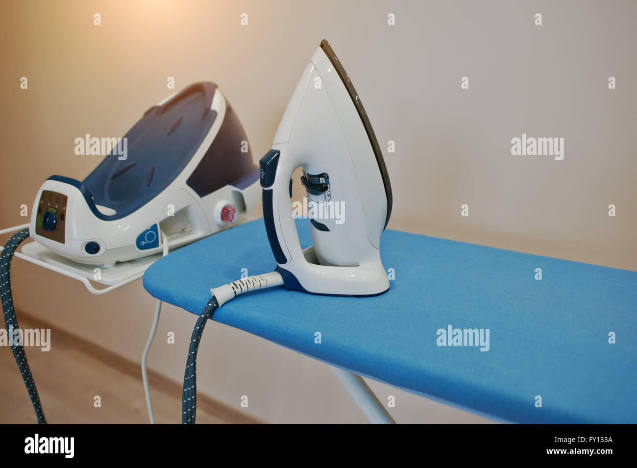 Ironing board with steam iron system Stock Photo Alamy