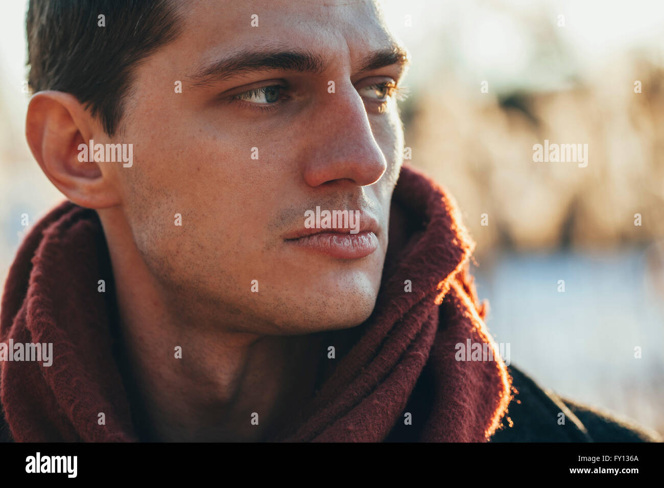 Close-up of young man standing outdoors Stock Photo