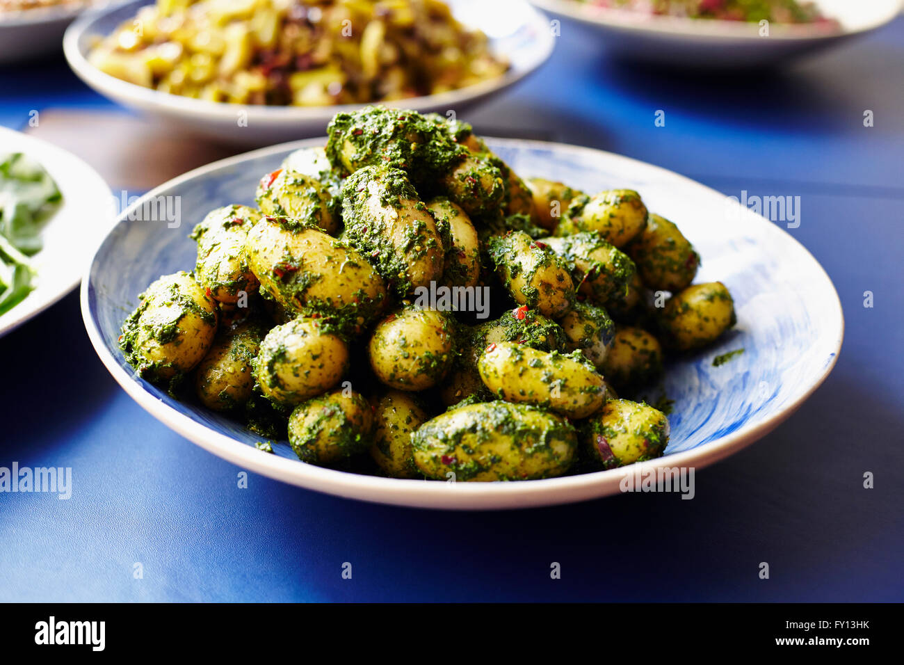 Close-up of prepared potatoes served in plate at table Stock Photo