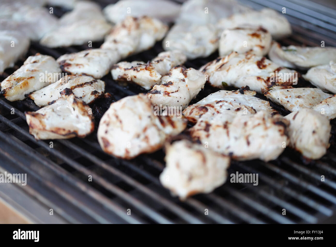 Close-up of grilled chicken meat on barbeque grill Stock Photo