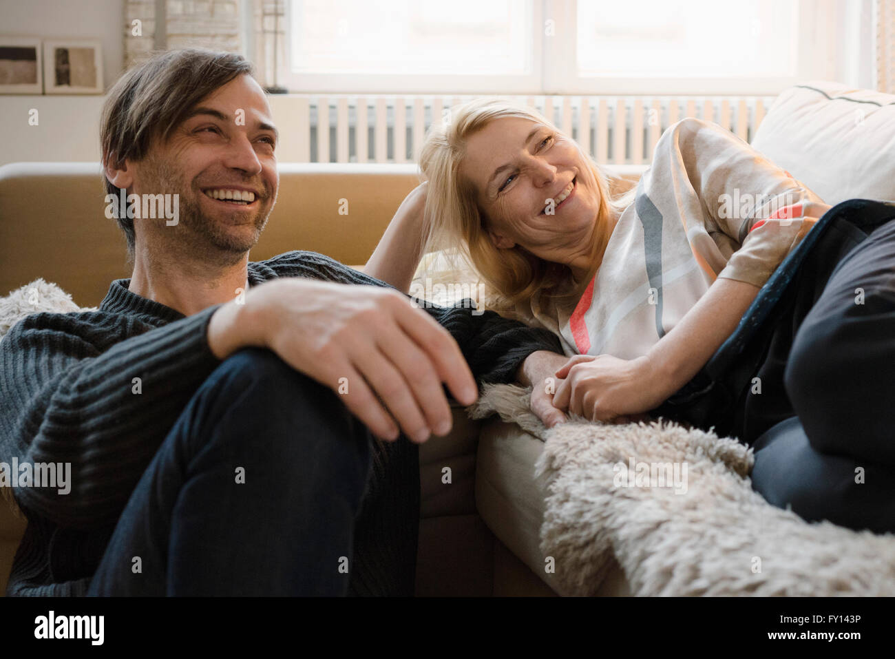Happy mature couple spending leisure time at home Stock Photo