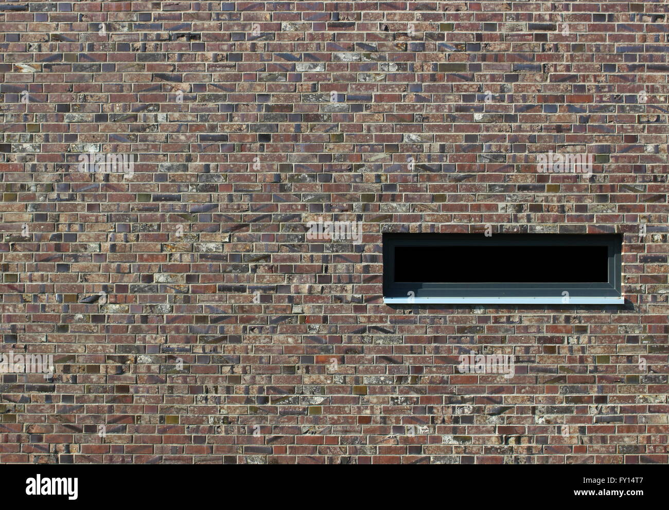Brick texture with different colors and styles and a window. Stock Photo