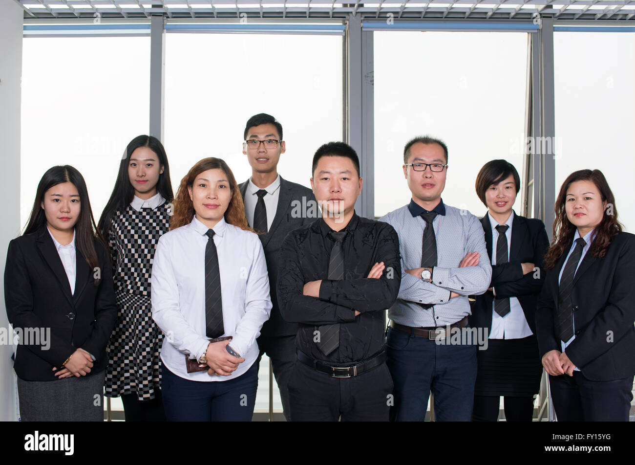 Professionals standing together business as one business team in the Office Stock Photo