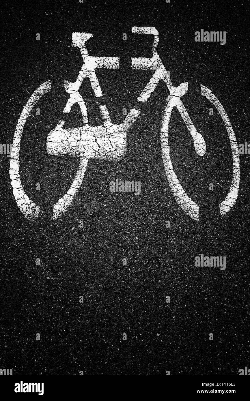 White bicycle sign on asphalt bike lane. Stock Photo