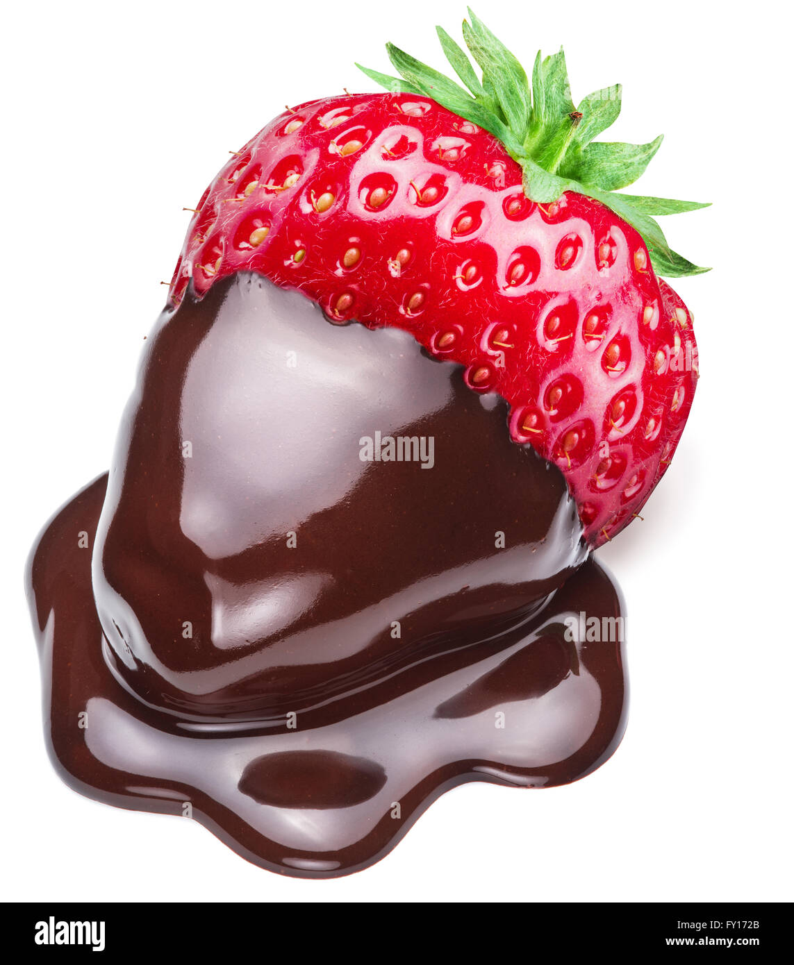 Strawberry dipped in chocolate fondue on white background. Stock Photo