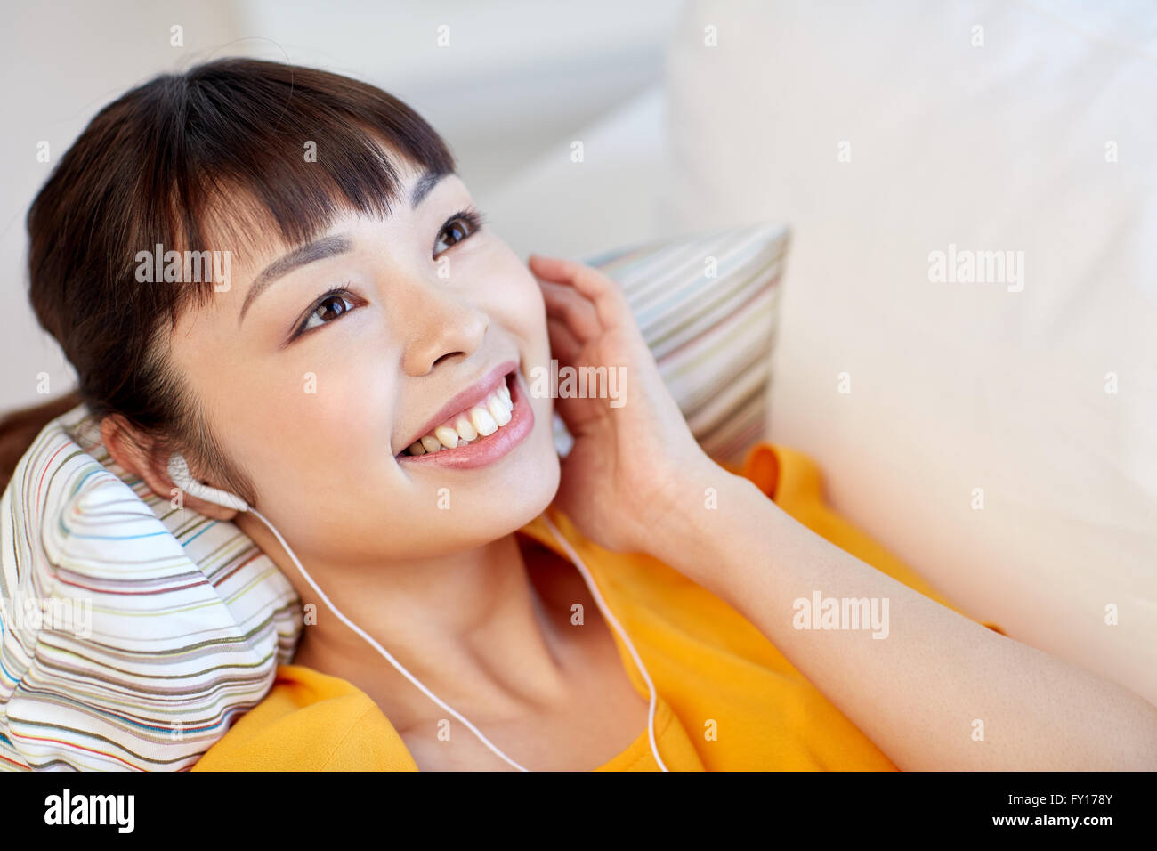 happy asian woman with earphones listening music Stock Photo - Alamy