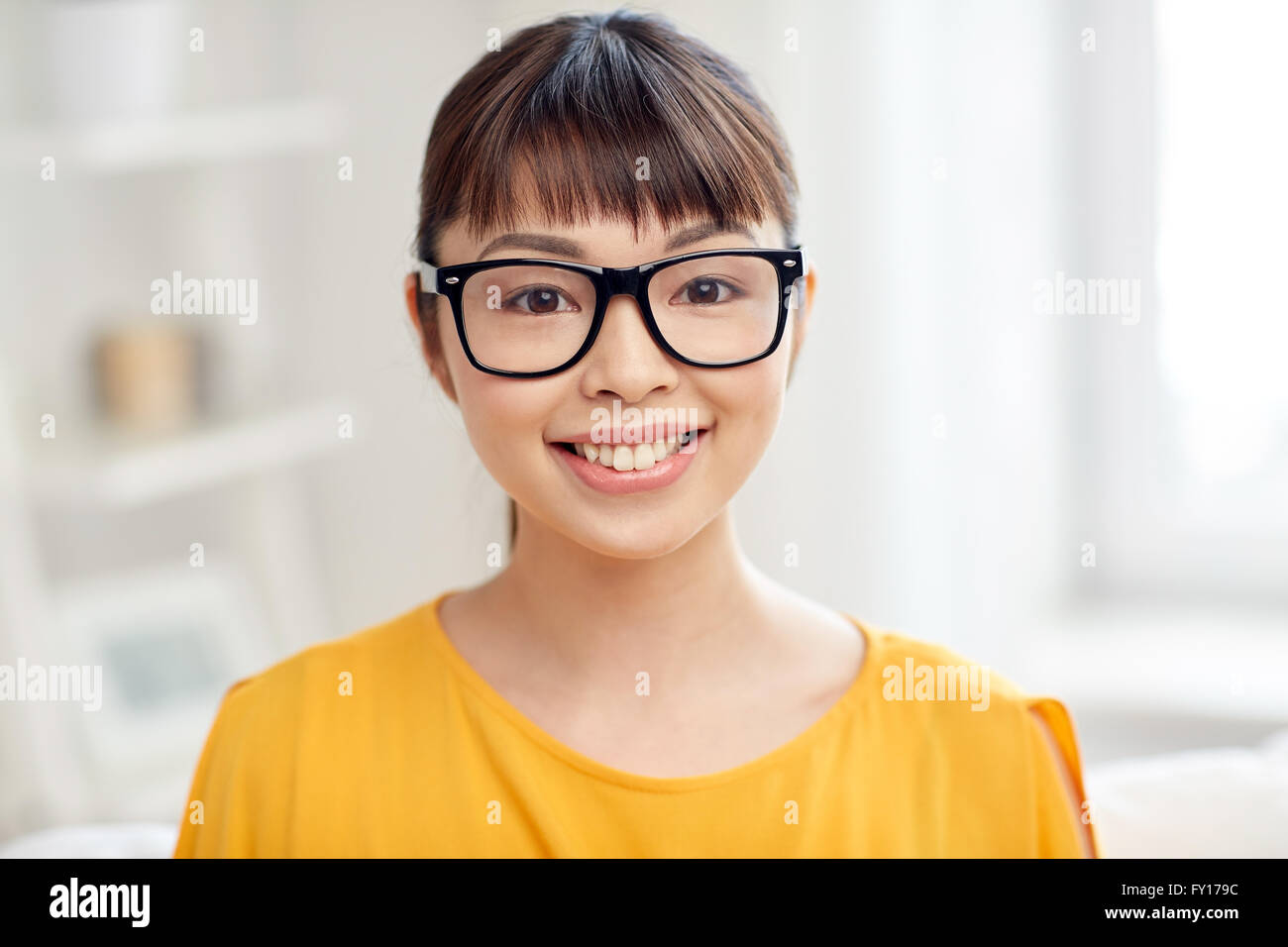 happy asian young woman in glasses at home Stock Photo - Alamy
