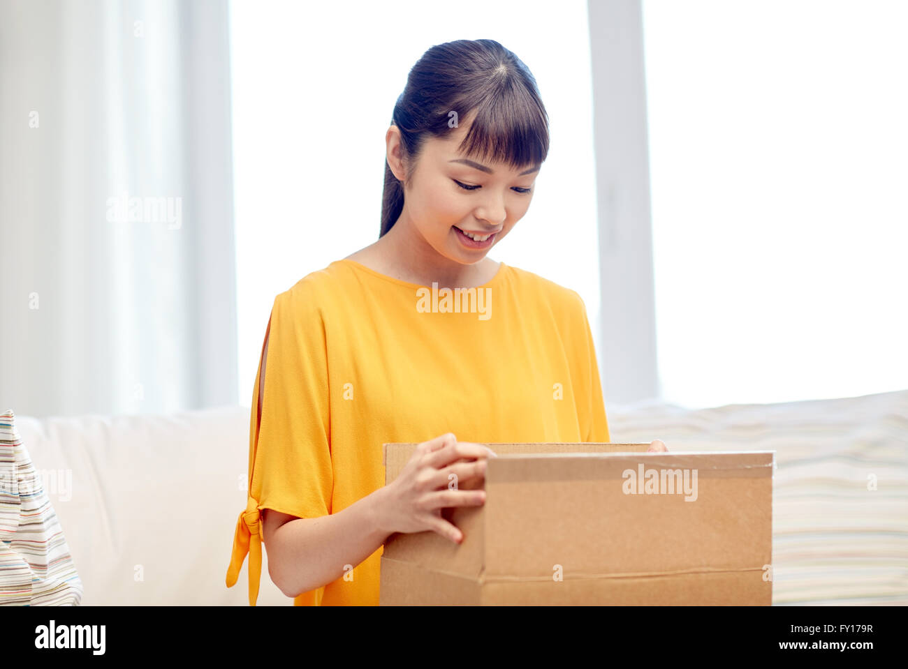 happy asian young woman with parcel box at home Stock Photo - Alamy