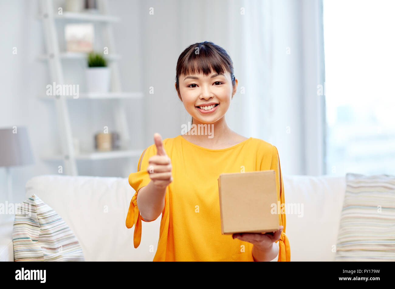 happy asian young woman with parcel box at home Stock Photo - Alamy