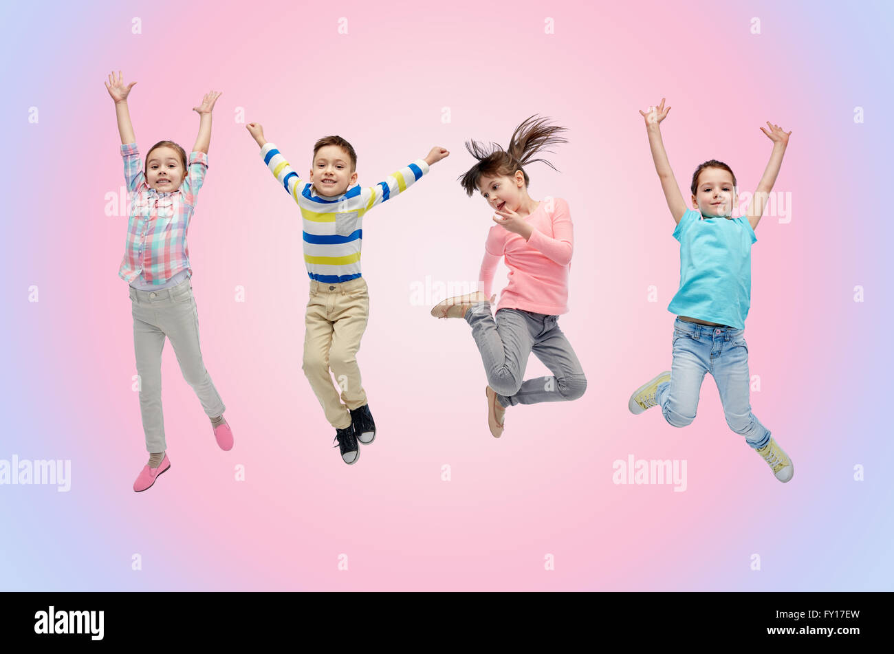 happy little children jumping in air Stock Photo - Alamy