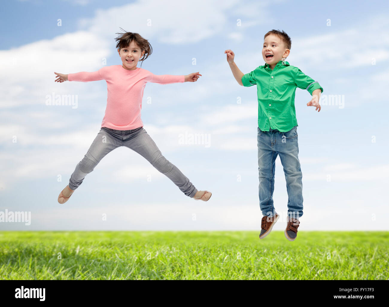 happy little girl jumping in air Stock Photo - Alamy