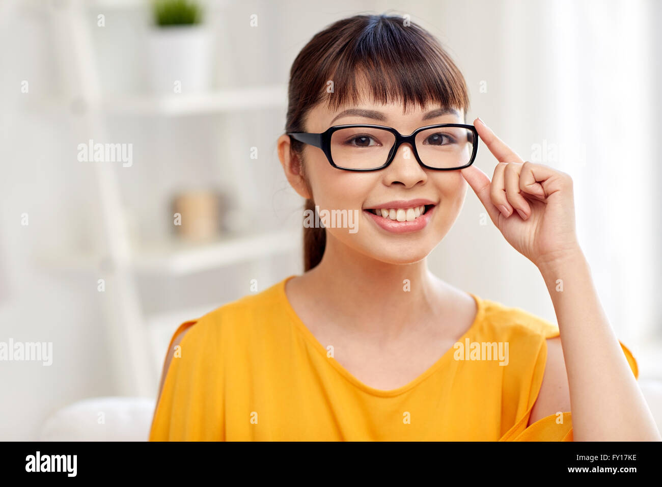 happy asian young woman in glasses at home Stock Photo - Alamy
