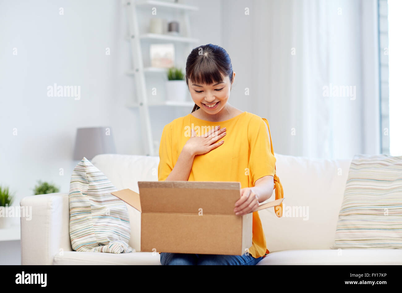 happy asian young woman with parcel box at home Stock Photo - Alamy