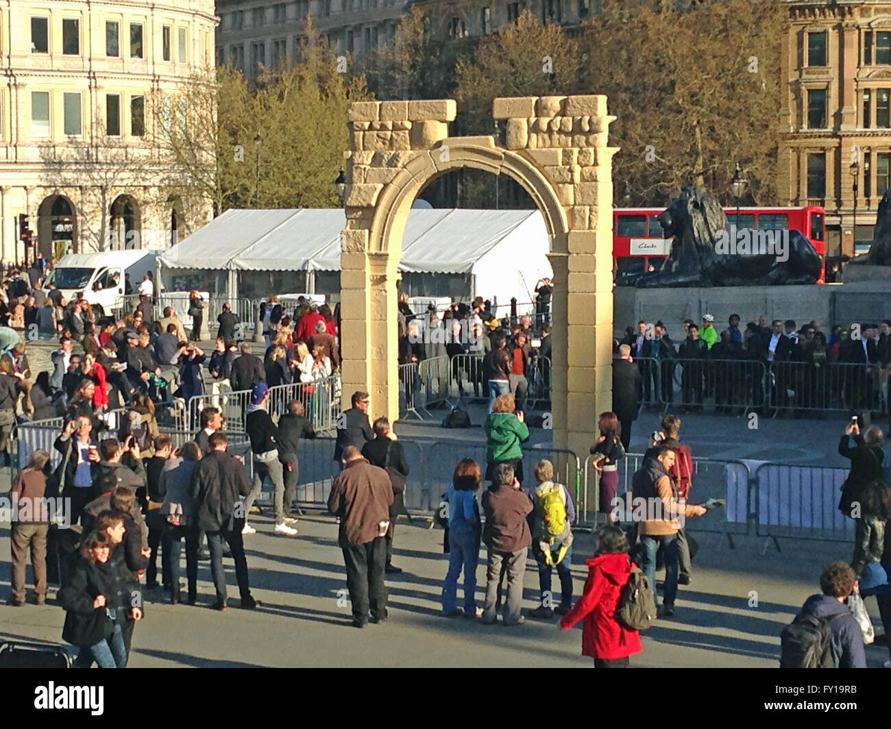 London, UK. 19th April, 2016. Crowds in London's Trafalgar Square surrounding a recreation of the historic Arch of Triumph from the Syrian city of Palmyra.  The ruin has been recreated using 3D printed marble and will travel the world. Credit:  Amanda Lewis/Alamy Live News Stock Photo