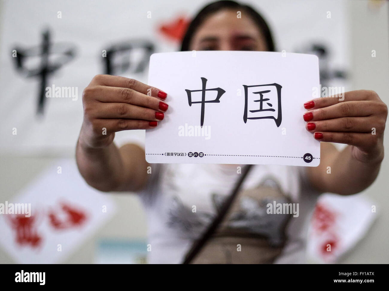 (160420) -- SAO PAULO (BRAZIL), April 20, 2016 (Xinhua) -- Image taken on April 18, 2016 shows a student holding a card with Chinese characters meaning 'China' during a Chinese language class at 'CEU Meninos' municipal public school in Sao Paulo, Brasil. Chinese classes at 'CEU Meninos' school are promoted in partnership between the school and the Confucius Intitute. Currently 125 students from six to fourteen years old attend the classes in 'CEU Meninos'. The Day of Chinese Language is celebrated annually on April 20, aiming to promote multilingualism, cultural diversity and equal usage of th Stock Photo