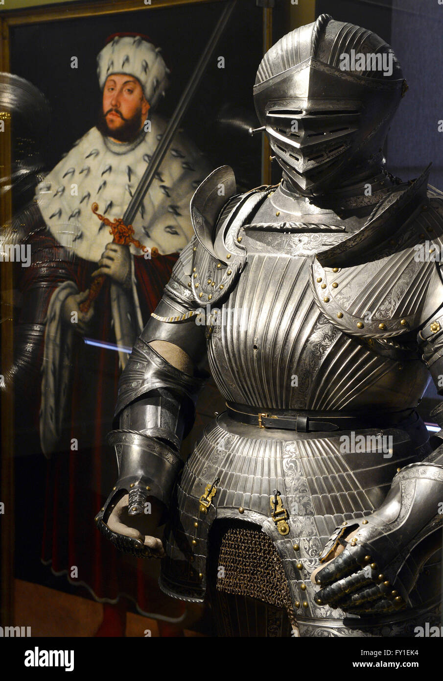 Knight's armour (R) from 1530 is on display next to a painting of John Frederick I, Elector of Saxony, created in the workshop of Lucas Cranach the Elder around 1540/45, in the Thuringian state exhibition 'The Ernestines · A Dynasty Shapes Europe' at the New Museum in Weimar, Germany, 20 April 2016. Unique exhibits from the Protestant Reformation in the 16th century to the end of the German Empire in 1918 will be showcased in Weimar and Gotha. The exhibition will run from 24 April to 28 August 2016. Photo: MARTIN SCHUTT/dpa Stock Photo
