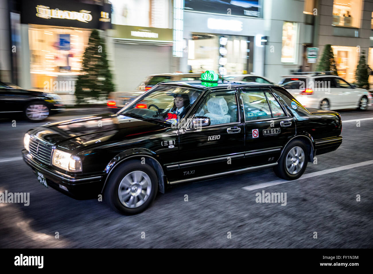 Toyota Crown taxi on Chuo Dori street in Ginza luxury district of Chuo