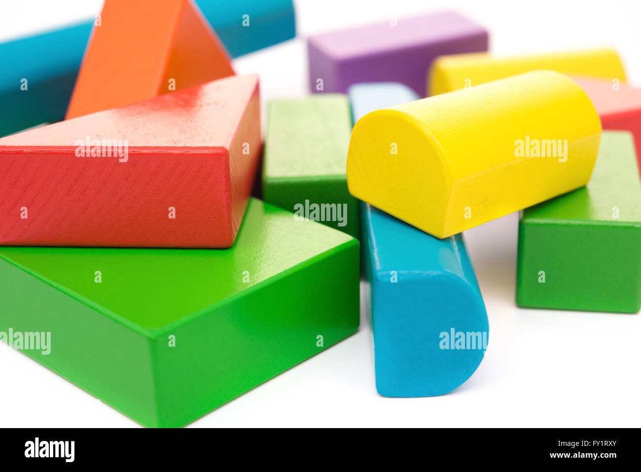 different color and shape wooden toy blocks on white background Stock Photo