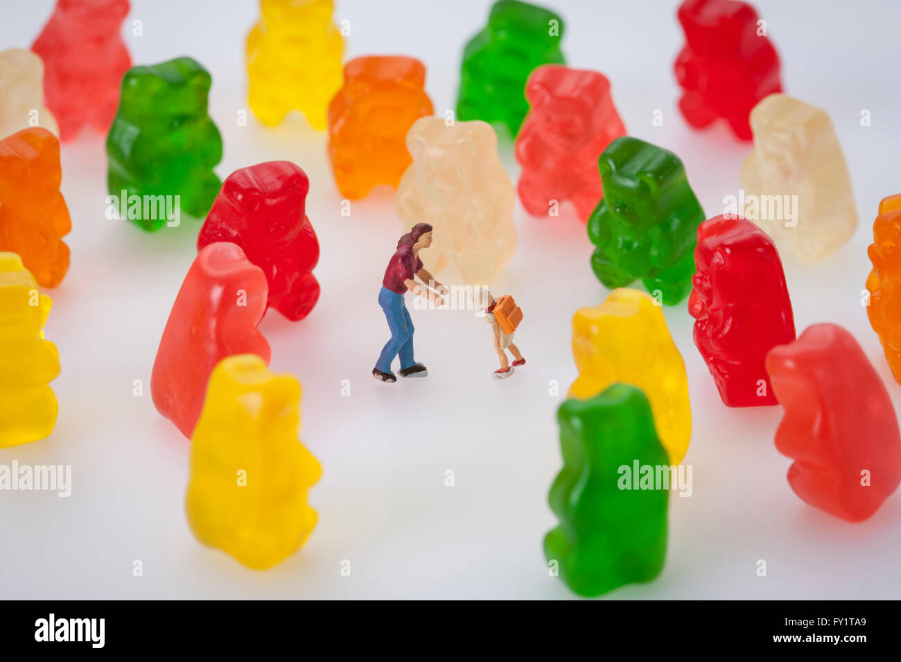 Colorful jelly with miniature of people Stock Photo Alamy