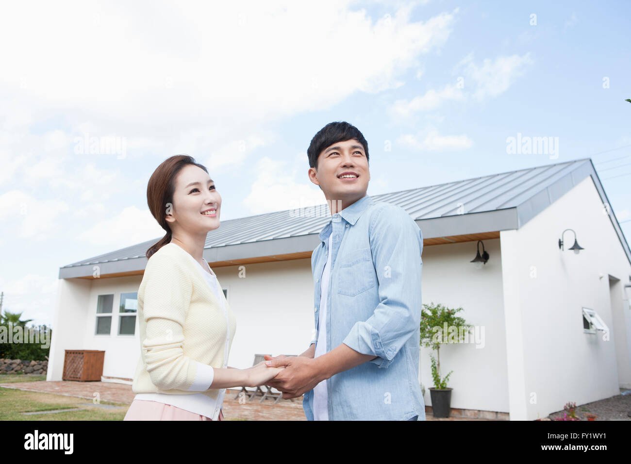 Asian couple holding hands hi-res stock photography and images - Alamy