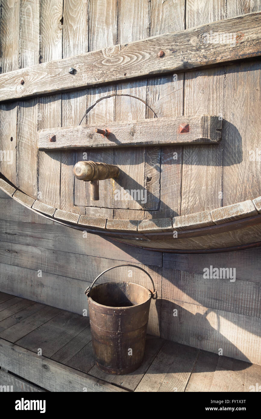 big wooden wine barrel with faucet Stock Photo