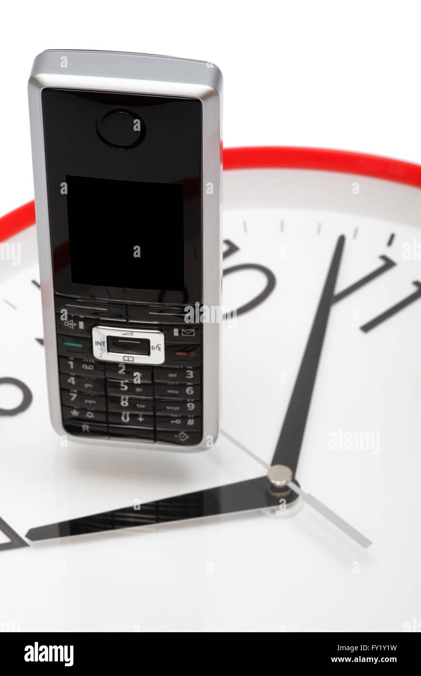 Modern phone on a dial of clock Stock Photo Alamy