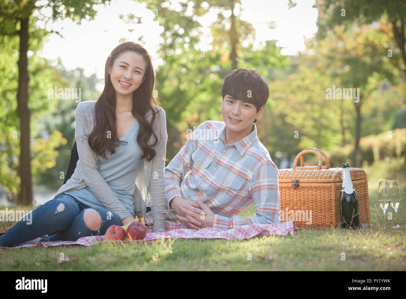 Sitting on picnic mat hi-res stock photography and images - Alamy