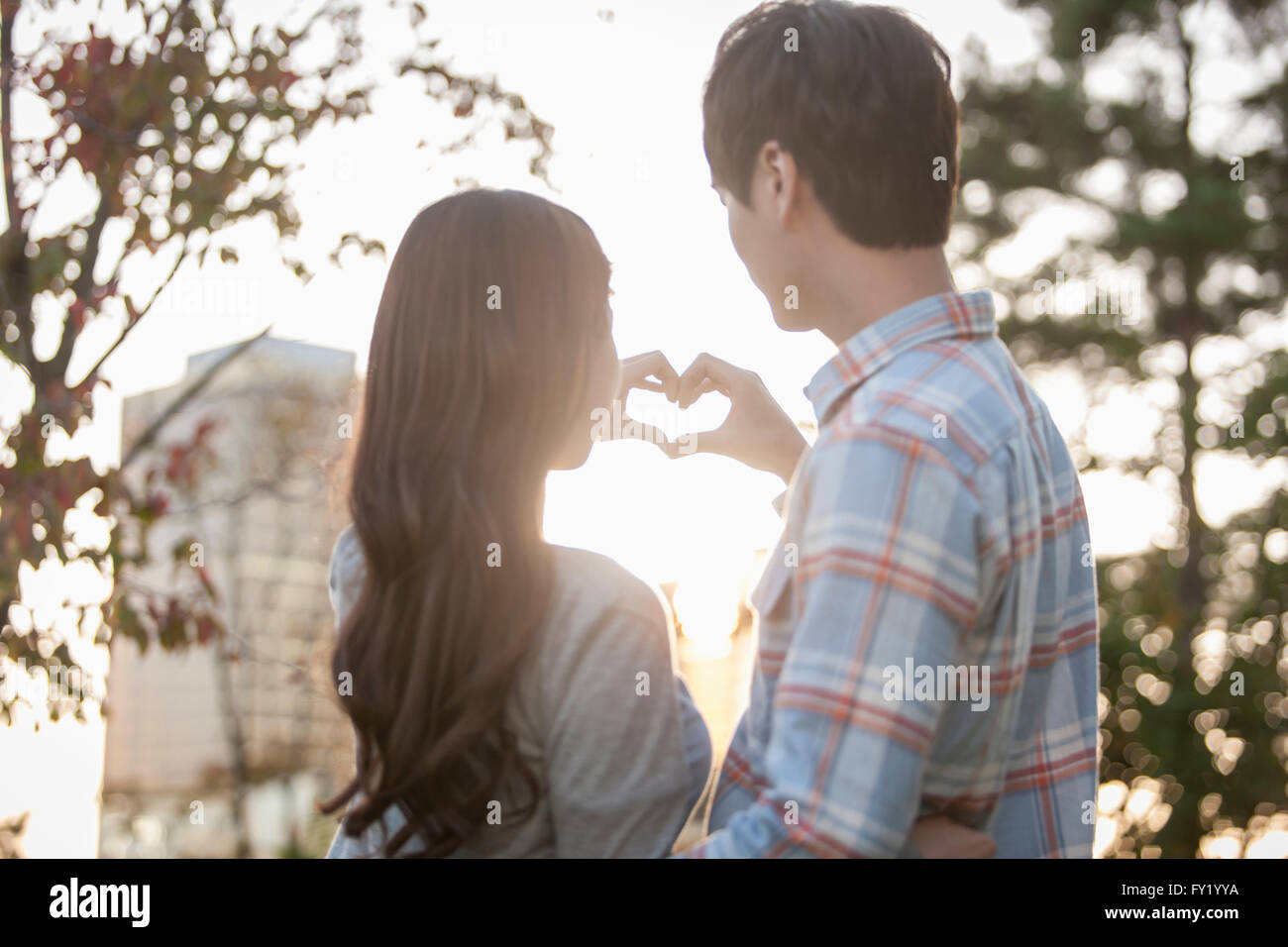 Couple making heart shape hands hi-res stock photography and images - Alamy