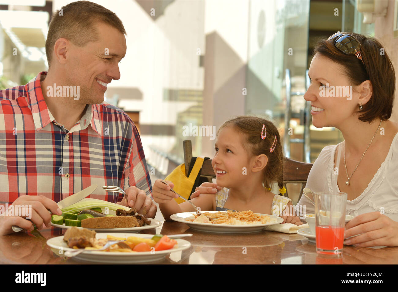 Happy family at breakfast Stock Photo - Alamy