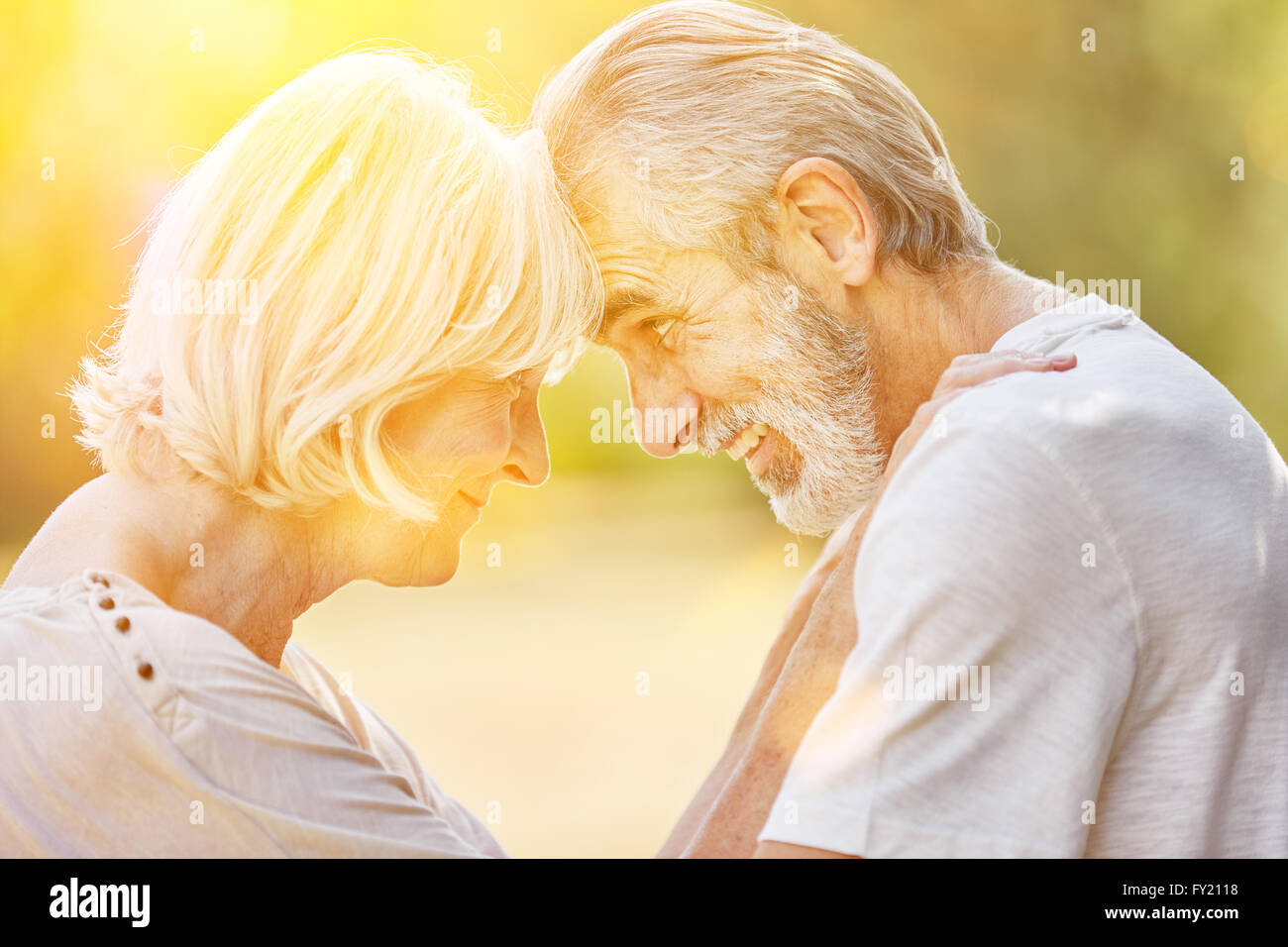 Old man and old woman in love in summer in the nature Stock Photo - Alamy