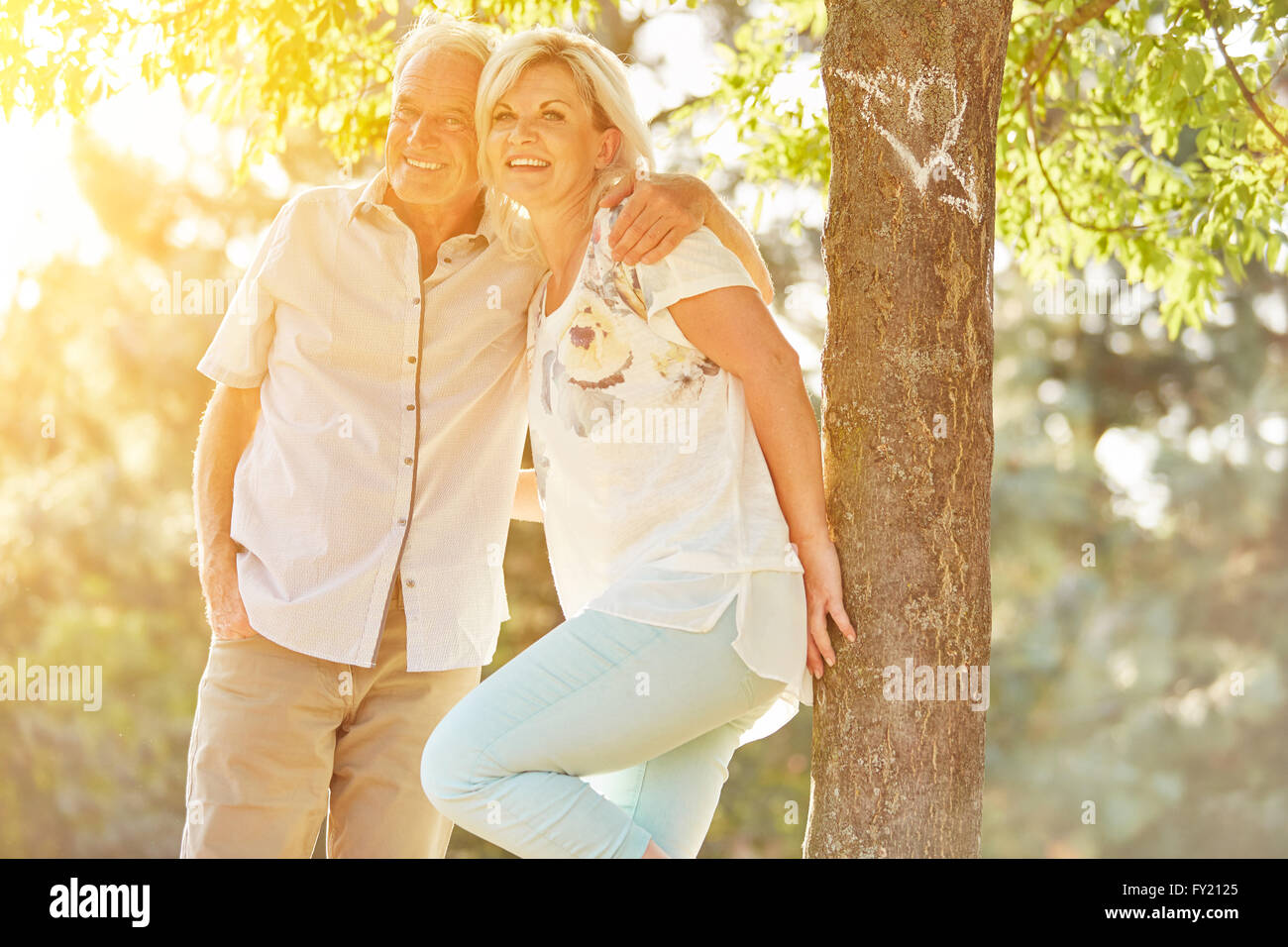 Happy senior couple in love in summer in the nature Stock Photo