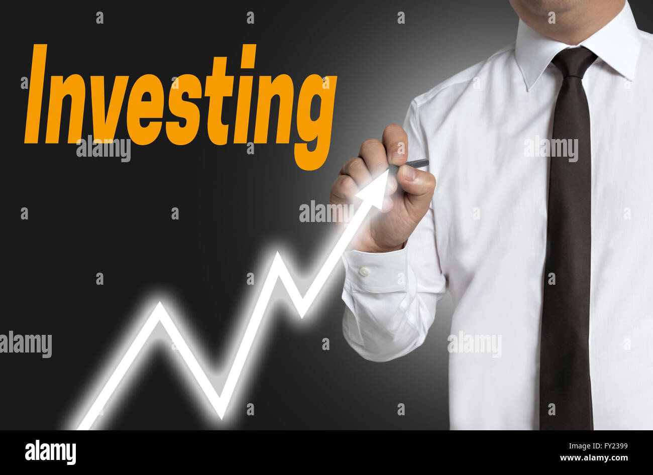 investing trader draws market price on touchscreen. Stock Photo