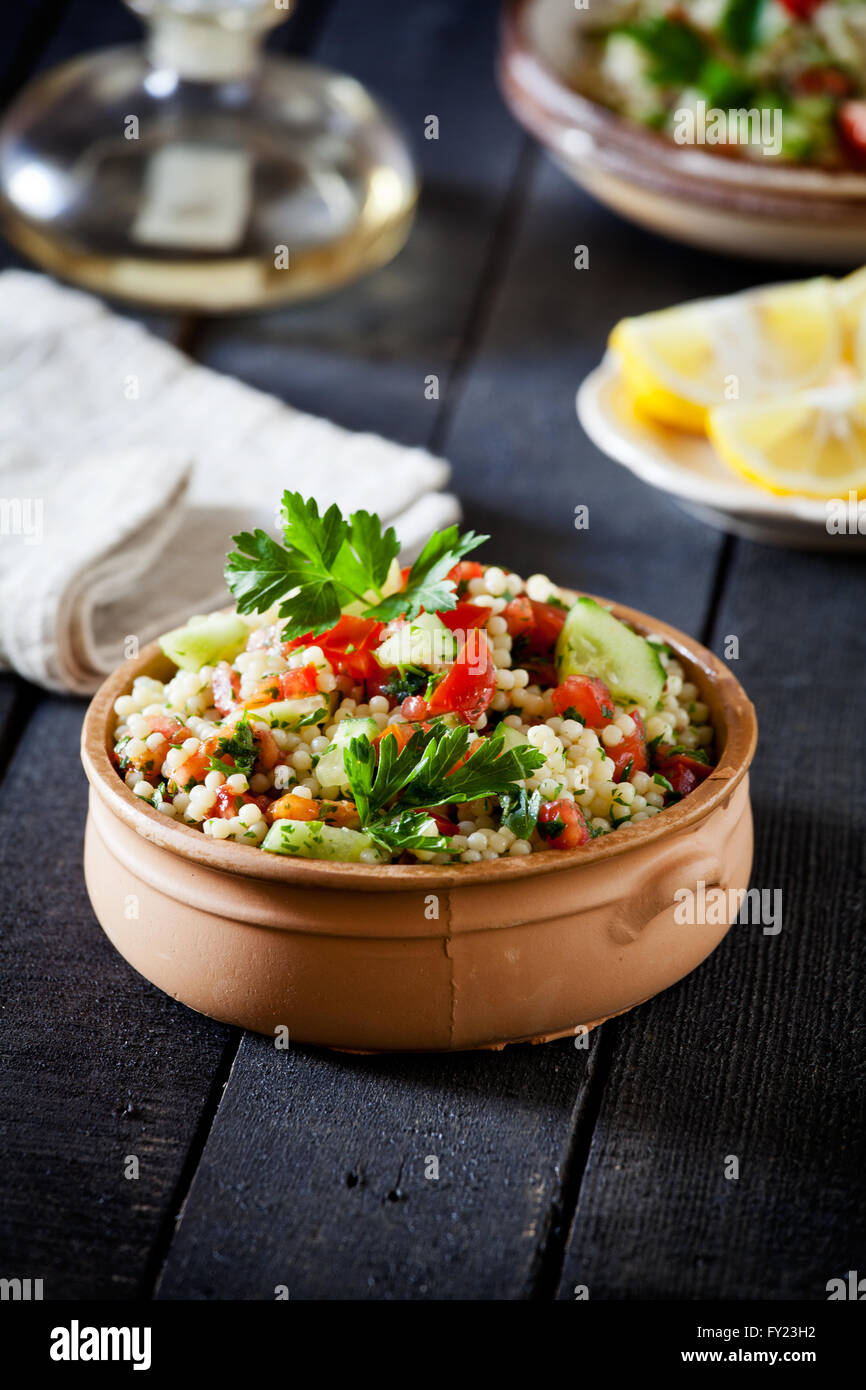 Ceramic bowl of refreshing summer pasta salad Stock Photo