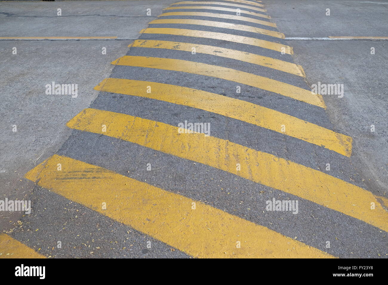 Washboard road, yellow caution Stock Photo Alamy