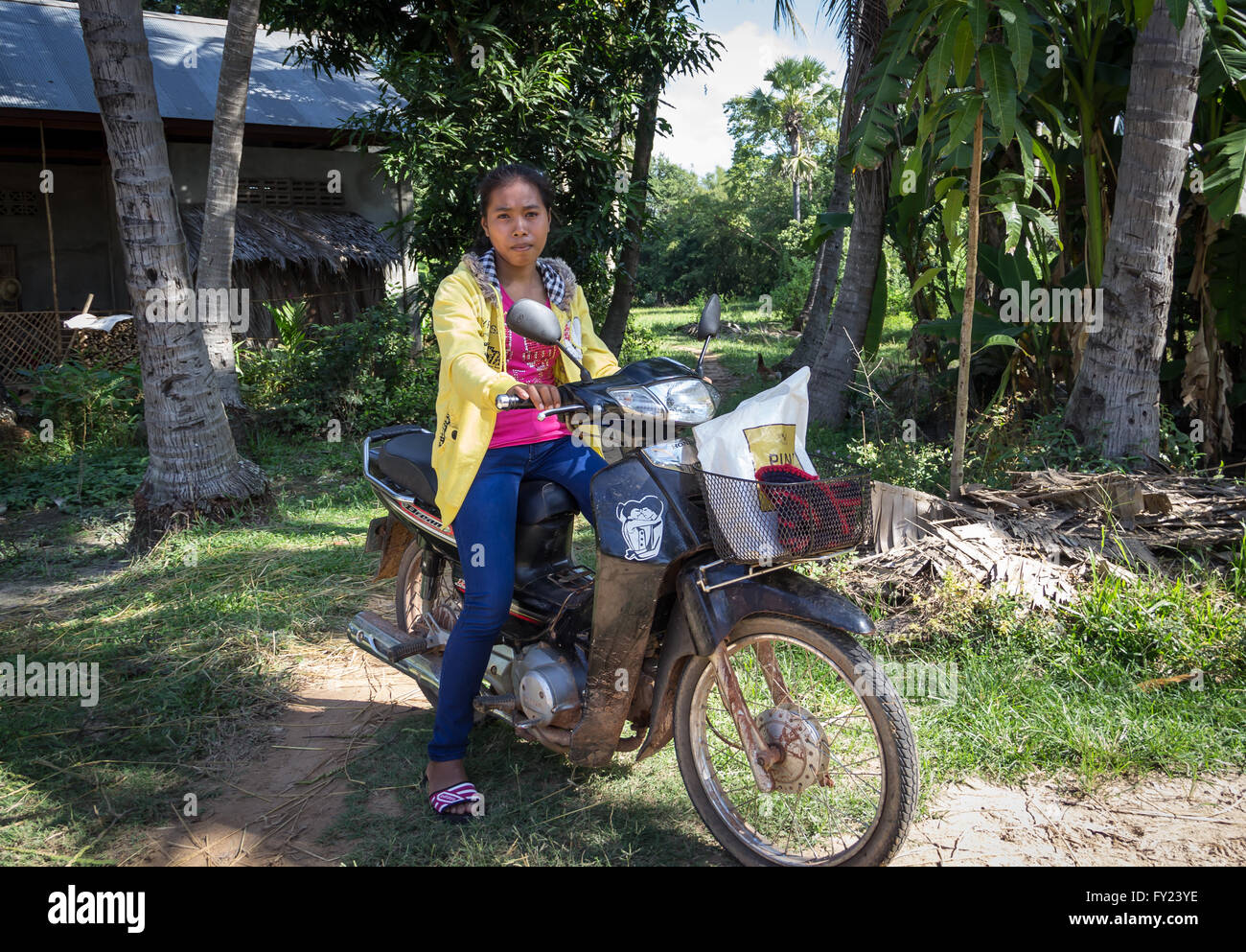Cambodian Girl on Motorcycle Stock Photo