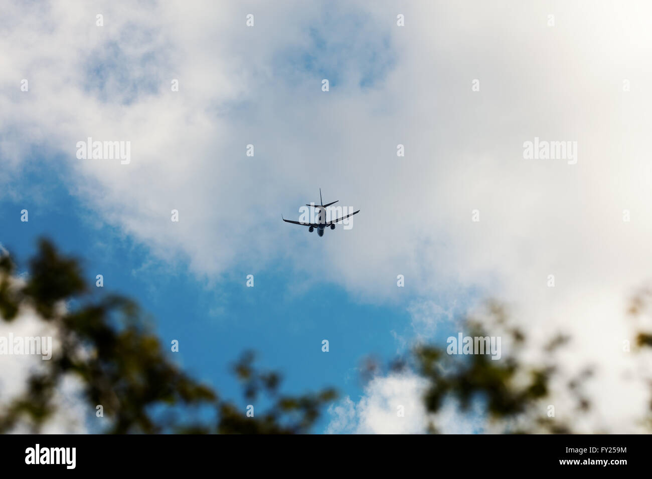 Jet flying in distance Stock Photo