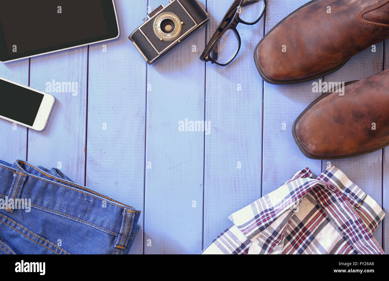 top view image of hipster accessories and clothes a wooden background. vintage filtered and toned Stock Photo